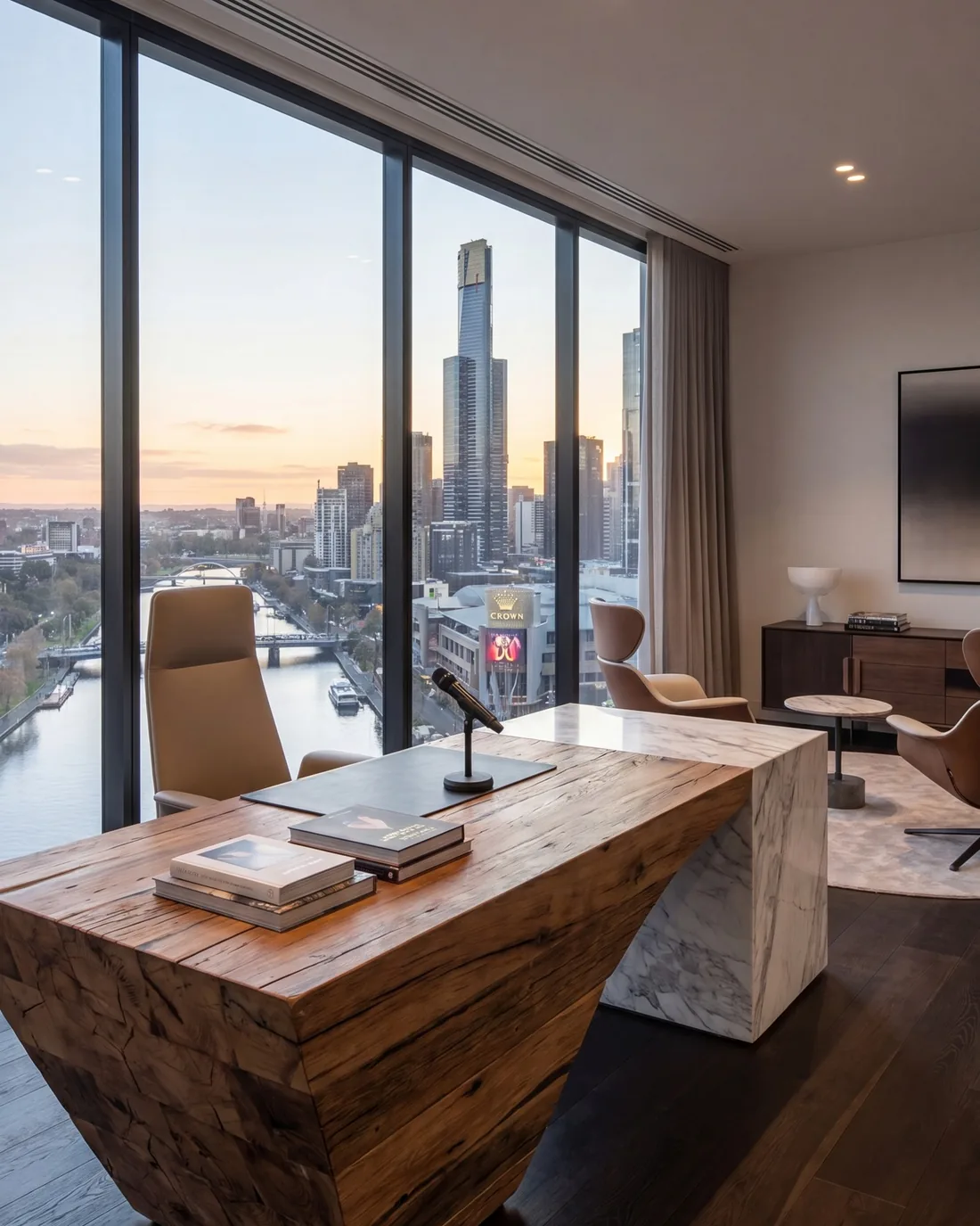 Executive office with a timber desk overlooking the Melbourne skyline at dusk